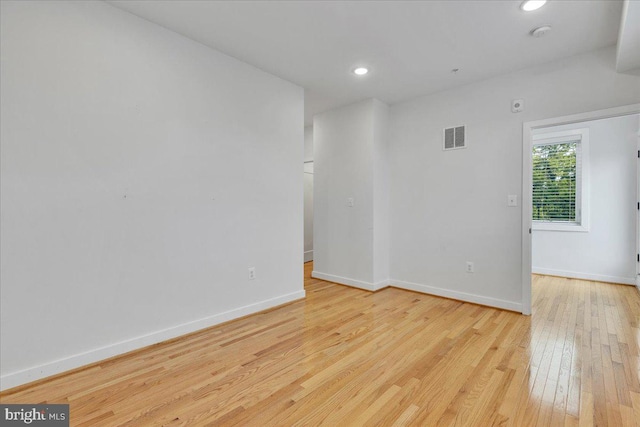 unfurnished room with light wood-type flooring