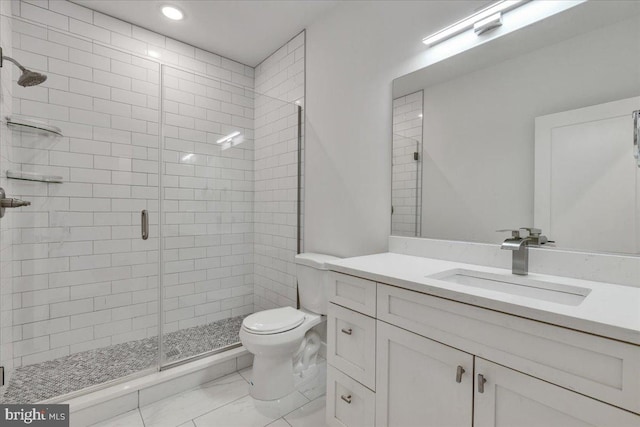 bathroom with vanity, toilet, and walk in shower