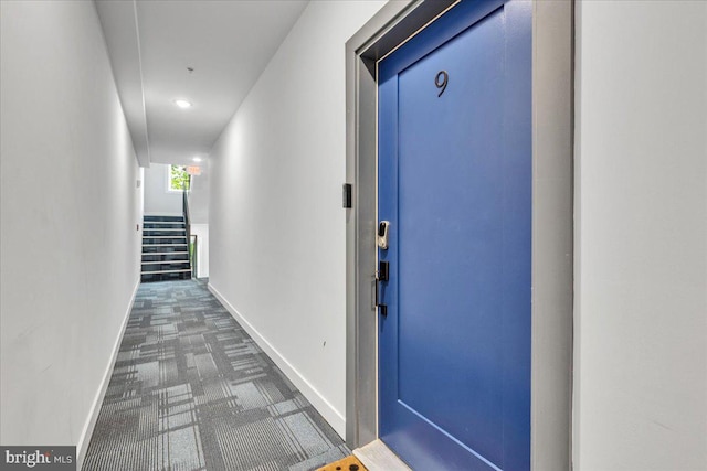 corridor featuring carpet flooring