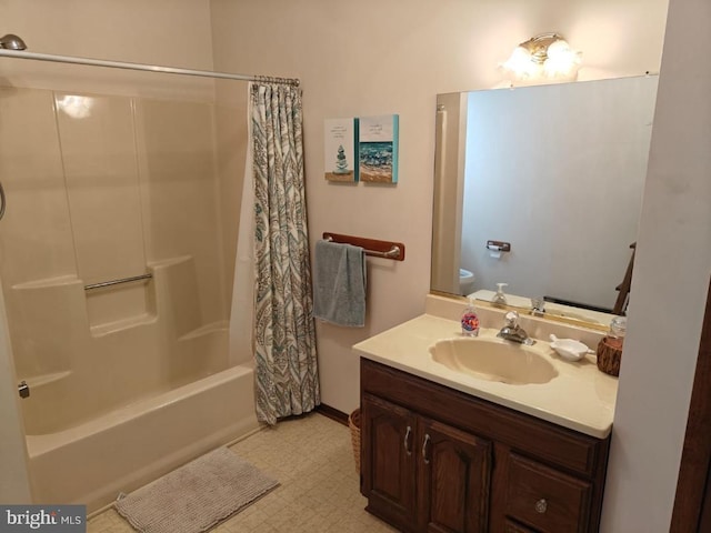 bathroom with shower / tub combo and vanity