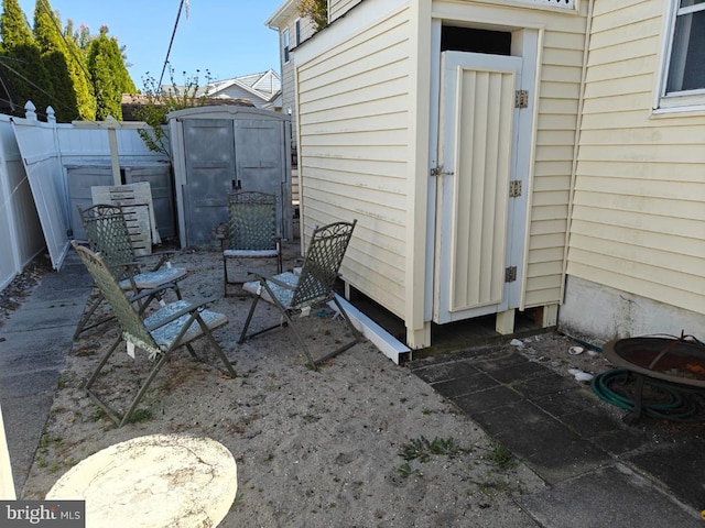 view of patio / terrace with a storage unit