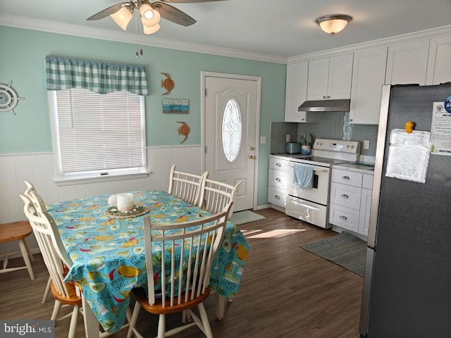 kitchen featuring backsplash, white cabinetry, white electric range, stainless steel refrigerator, and dark hardwood / wood-style flooring