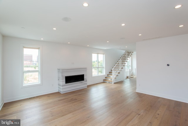 unfurnished living room featuring light hardwood / wood-style flooring