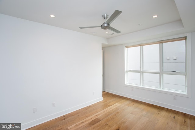 unfurnished room featuring ceiling fan and light wood-type flooring