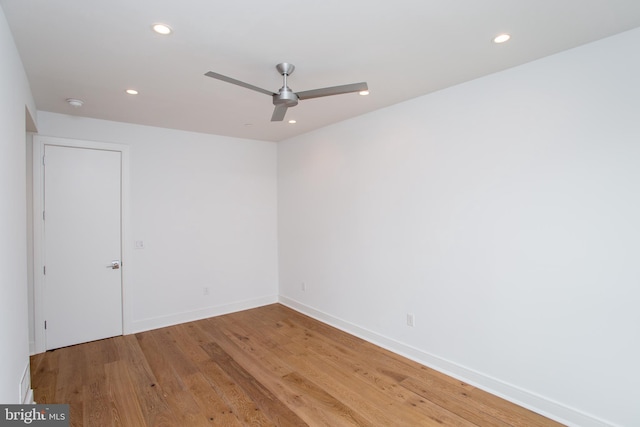 unfurnished room with light wood-type flooring and ceiling fan