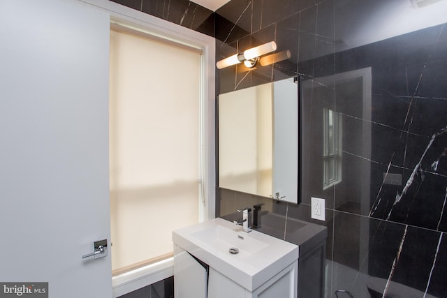 bathroom with decorative backsplash and vanity