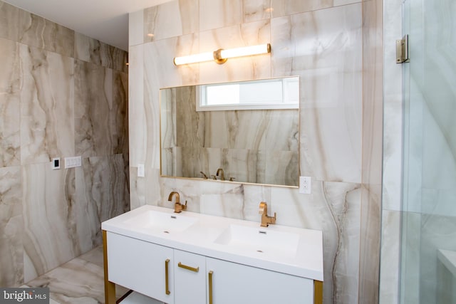 bathroom with tile walls, vanity, and tasteful backsplash