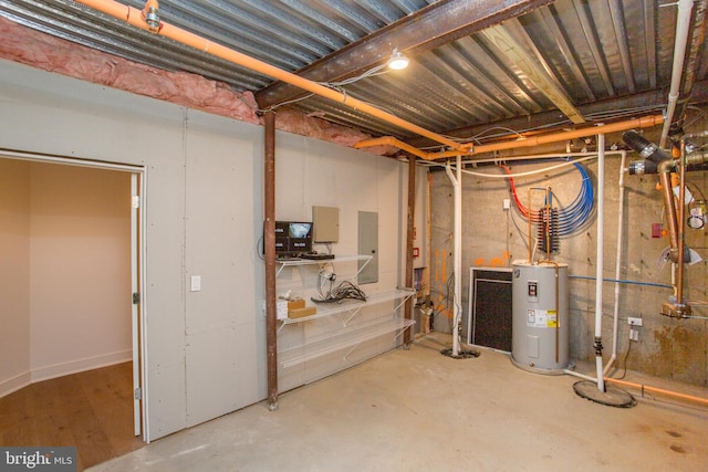 basement featuring water heater and electric panel