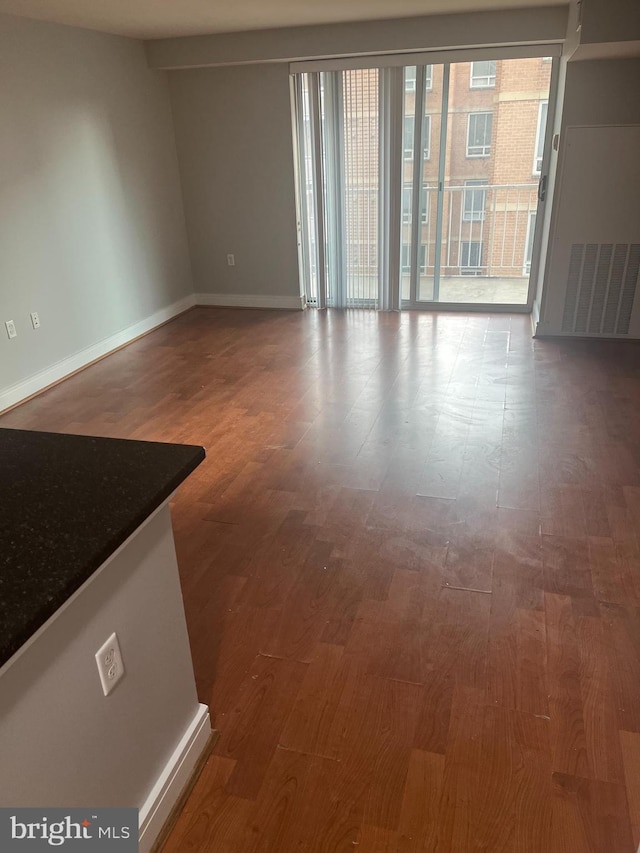 unfurnished room featuring hardwood / wood-style flooring