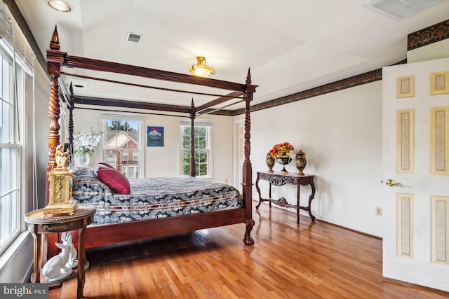 bedroom with hardwood / wood-style flooring