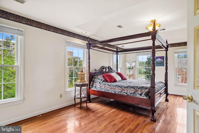 bedroom with hardwood / wood-style flooring