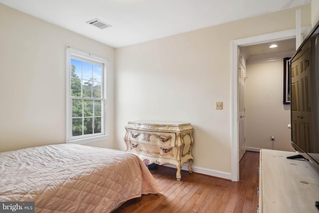 bedroom with wood-type flooring