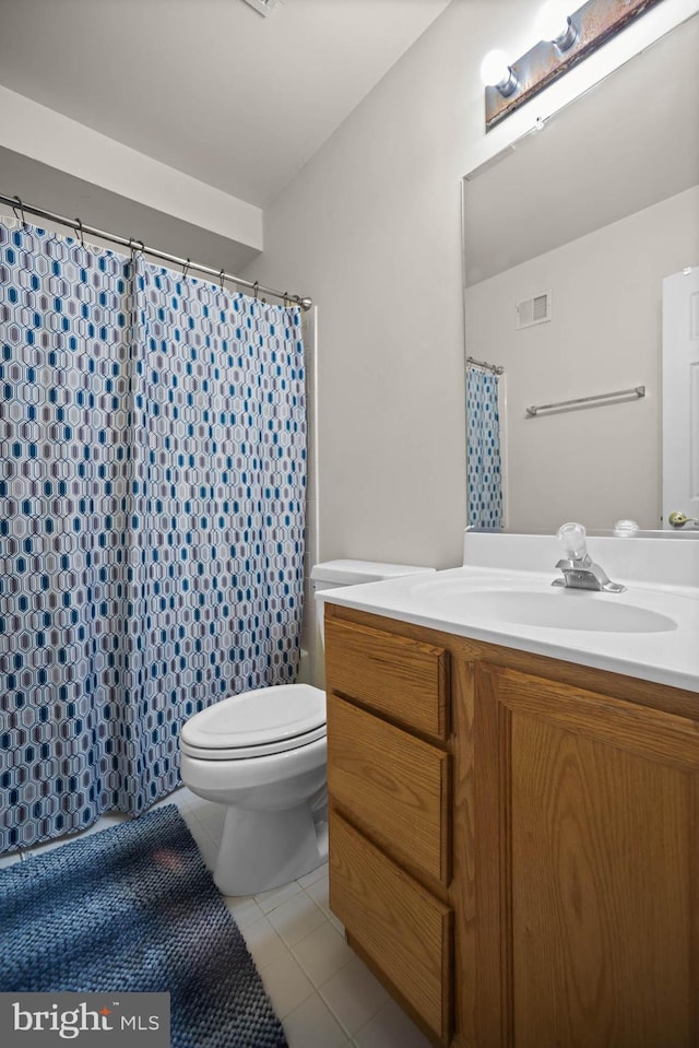 bathroom with vanity, tile patterned flooring, toilet, and a shower with shower curtain