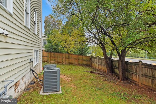 view of yard featuring central air condition unit