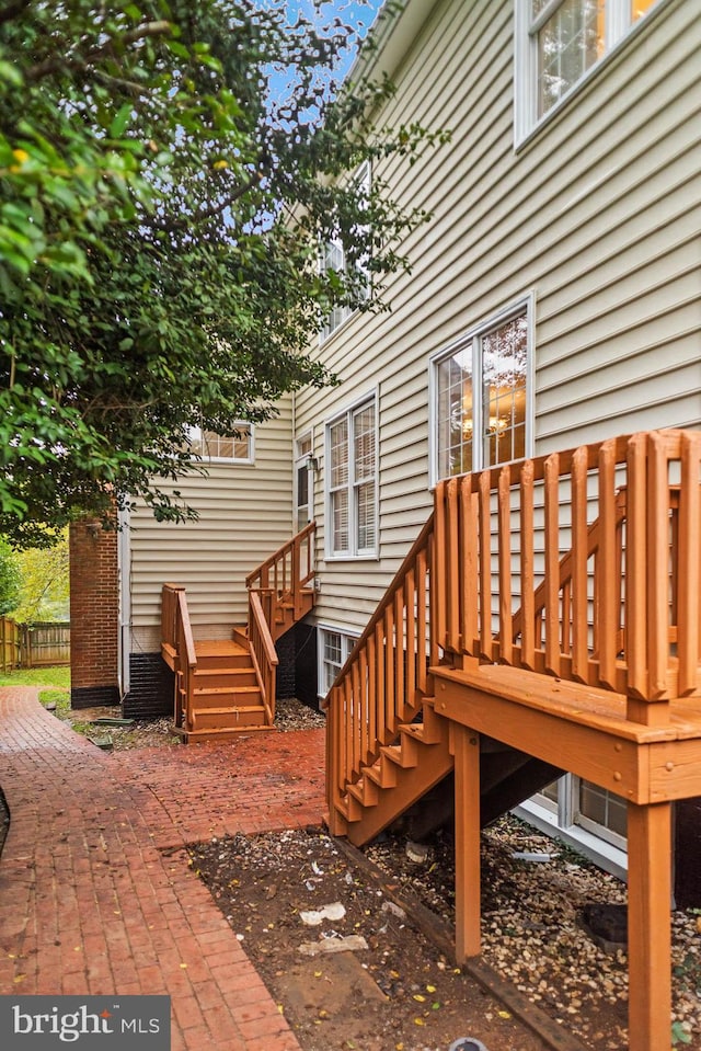 wooden deck with a patio