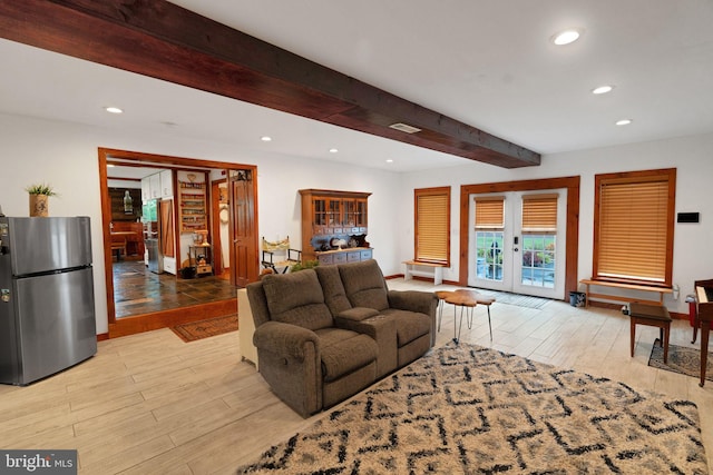 living room with light wood-type flooring, beam ceiling, and french doors