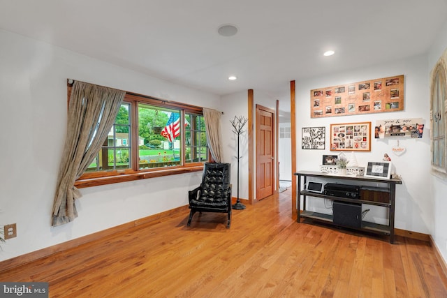 living area with light hardwood / wood-style floors