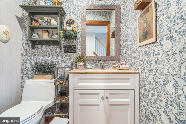 bathroom with vanity and toilet