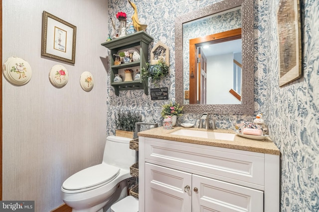 bathroom with vanity and toilet