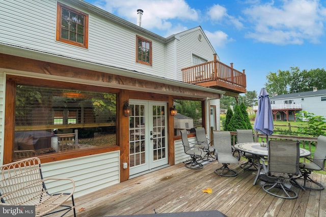 wooden deck featuring french doors