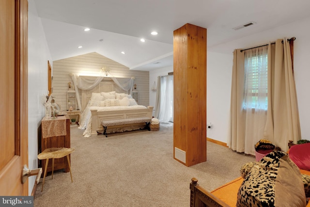 bedroom featuring carpet floors and vaulted ceiling