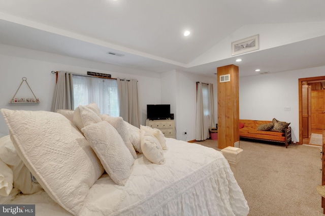 carpeted bedroom with lofted ceiling