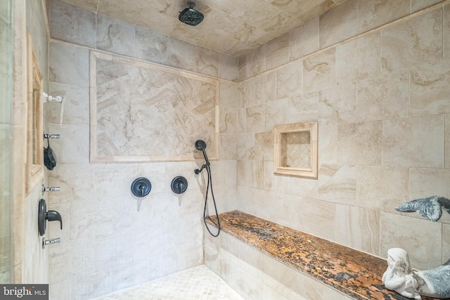 bathroom with tiled shower