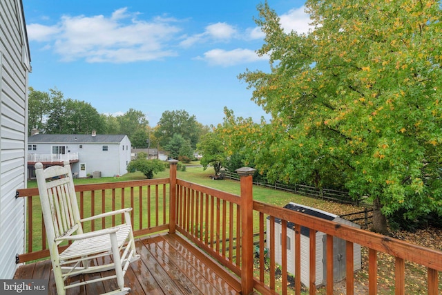 wooden deck with a yard