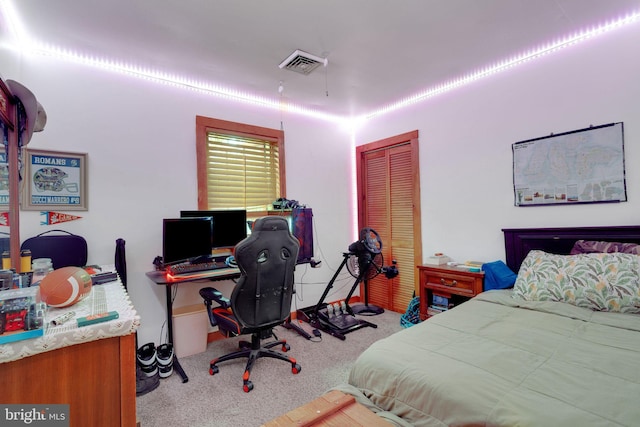 carpeted bedroom featuring a closet