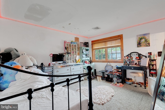 playroom with carpet and crown molding