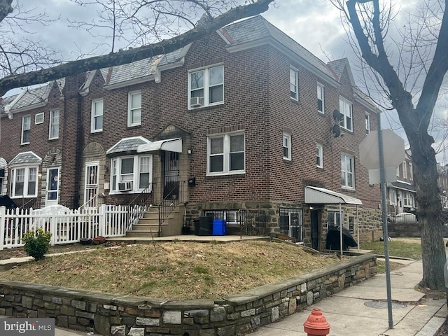 view of front of house featuring cooling unit