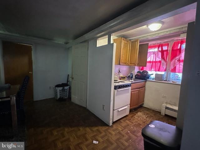 kitchen with dark parquet flooring, sink, a baseboard heating unit, and white range oven