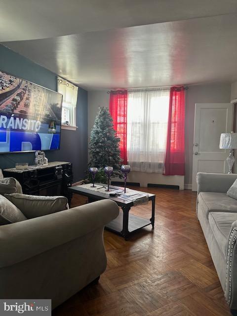 living room with parquet floors