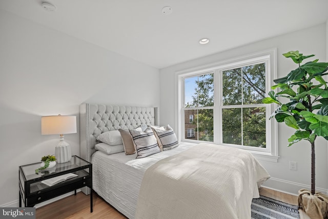 bedroom with wood-type flooring