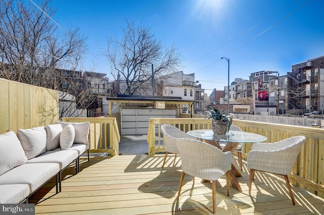 wooden terrace featuring an outdoor hangout area