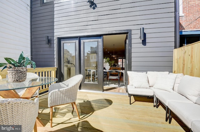 wooden deck with outdoor lounge area