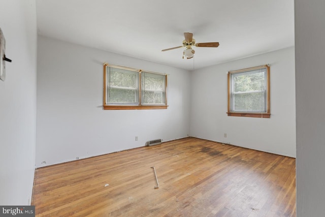 unfurnished room featuring hardwood / wood-style floors and ceiling fan