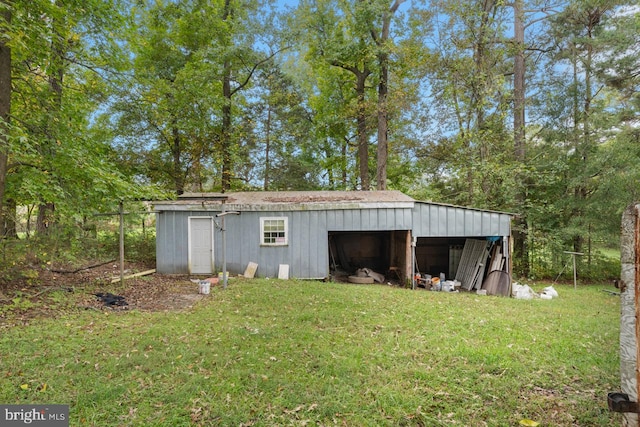 view of outbuilding with a yard