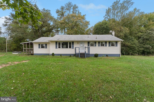 back of property featuring a lawn