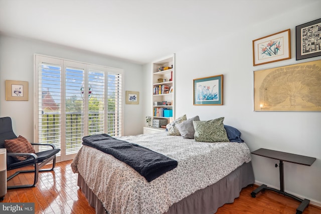 bedroom with hardwood / wood-style flooring