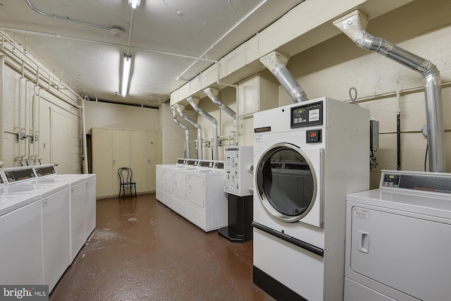 clothes washing area featuring washing machine and dryer