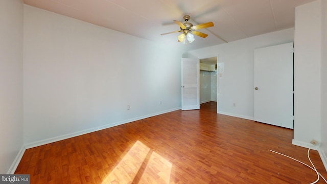 spare room featuring hardwood / wood-style flooring and ceiling fan