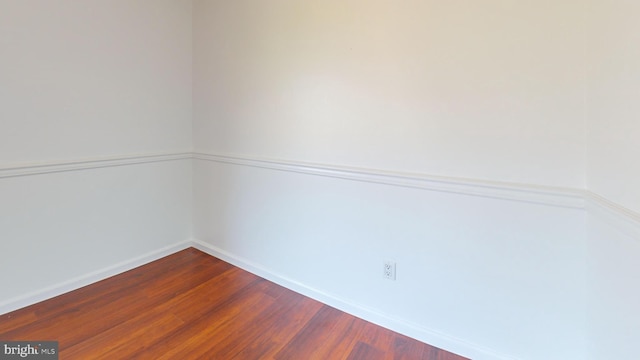 unfurnished room featuring wood-type flooring