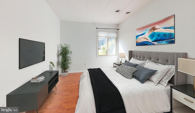 bedroom with light hardwood / wood-style flooring