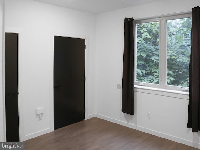 empty room featuring dark hardwood / wood-style floors