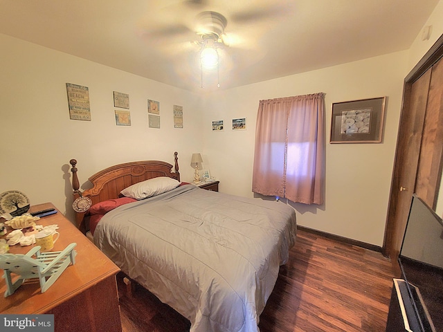 bedroom featuring ceiling fan and dark hardwood / wood-style floors