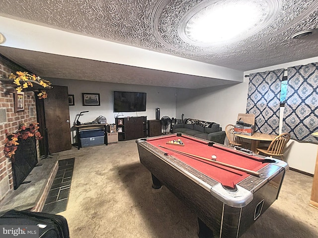 recreation room featuring billiards and a textured ceiling