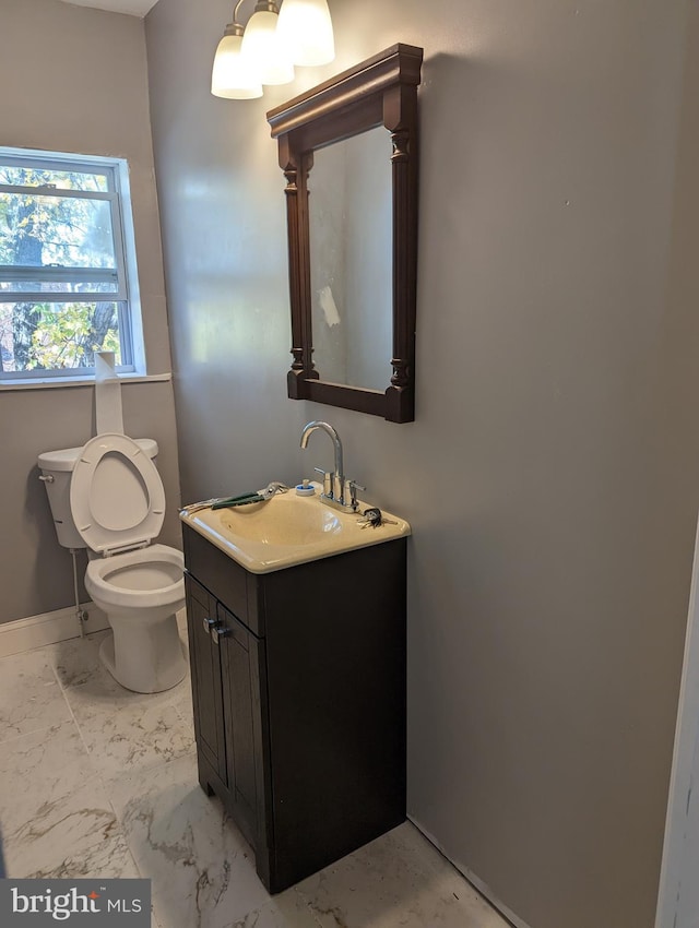 bathroom featuring vanity and toilet