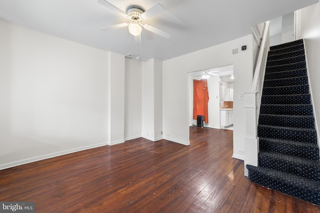 unfurnished room featuring ceiling fan and dark wood-type flooring