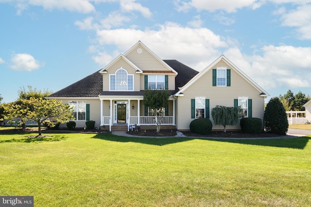 view of front of property with a front yard and covered porch